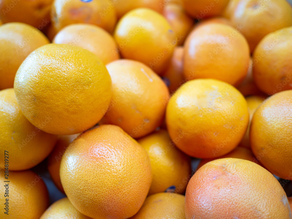 Heap of fresh red ruby grapefruit for sale in the market close up top view Heap of fresh red ruby grapefruit for sale in the market close up top view
