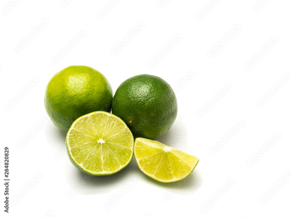 Two limes and two peaces isolated on white background. Two limes and two peaces isolated on white background.