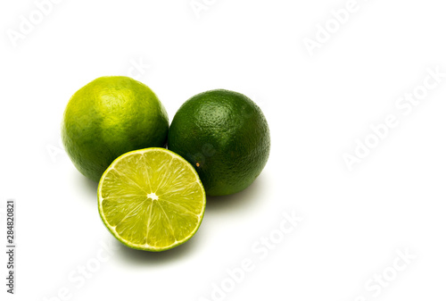 Two and a half limes isolated on white background.