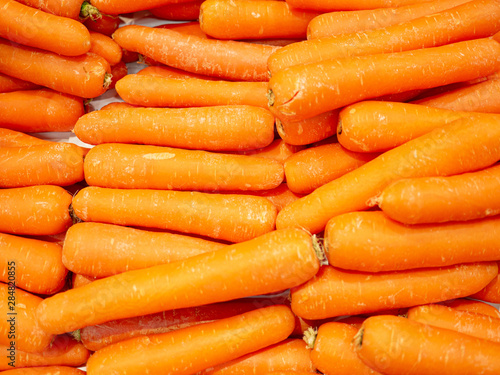 Bunch of fresh orange carrots for sale in the market top view