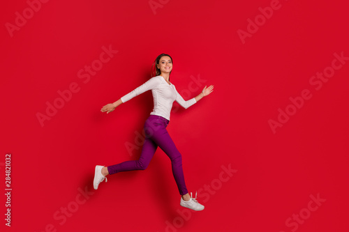 Full length body size photo of furious woman out of control losing video game while isolated with red background