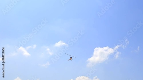 Helicopter flies over the beach photo