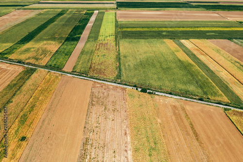 Aerial view of railway through cultivated countryside landscape