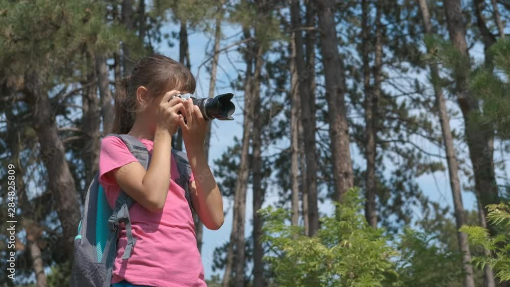 Teenager girl with a camera on the nature. Teenager girl with a camera on the nature.