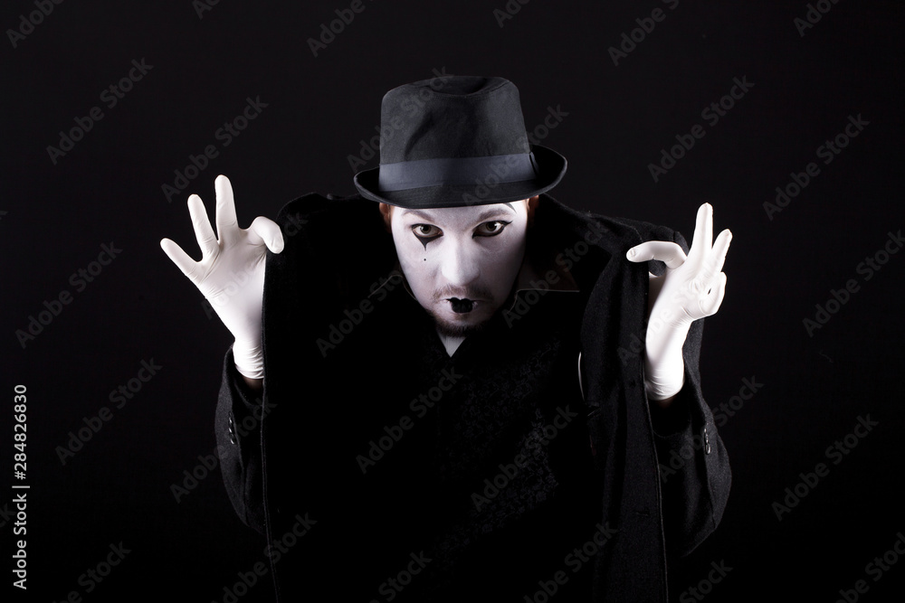 mime shows theatrical emotions on black background mime shows theatrical emotions on black background