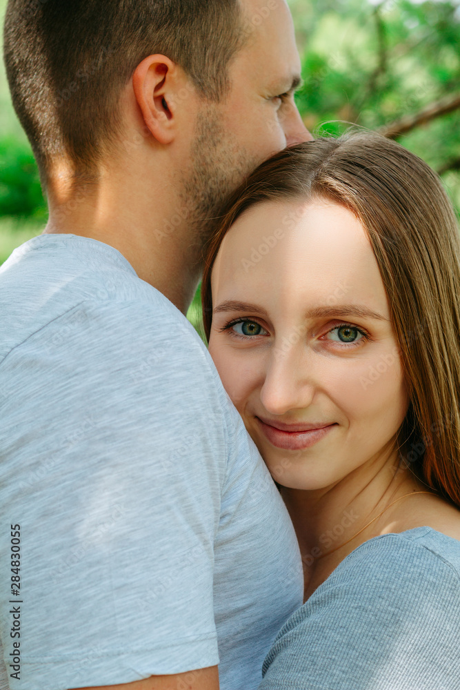 Fototapeta premium Loving couple holding tight and embracing close