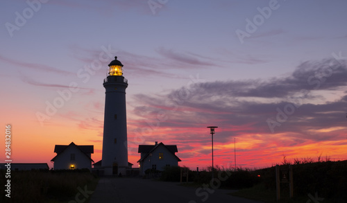 Hirtshals lighthouse at sunset on the coast of Denmark © poliki