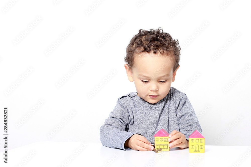 little boy testing his creativity by building towers with toy building blocks stock photo little boy testing his creativity by building towers with toy building blocks stock photo