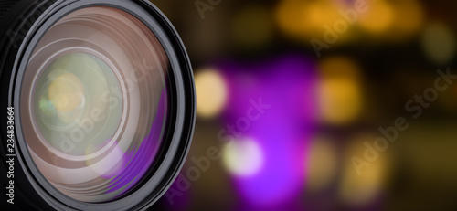 DSLR Camera Lens Isolated. Closeup Reflections in Lens. Blurred Background and Abstract Bokeh.