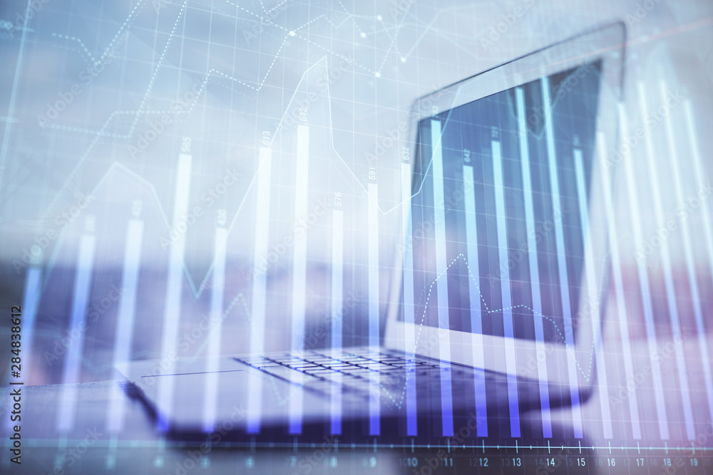 Forex Chart hologram on table with computer background. Multi exposure. Concept of financial markets. Forex Chart hologram on table with computer background. Multi exposure. Concept of financial markets.