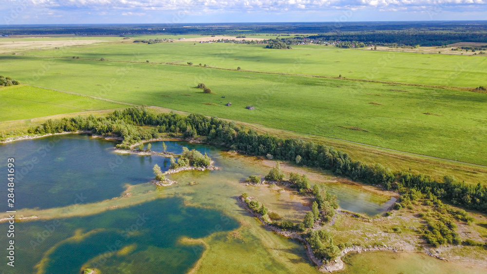 beautiful pond with Islands in the middle of green meadows