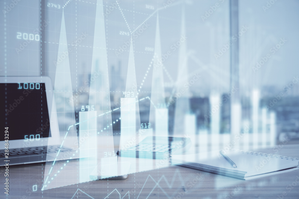 Forex graph hologram on table with computer background. Multi exposure. Concept of financial markets. Forex graph hologram on table with computer background. Multi exposure. Concept of financial markets.