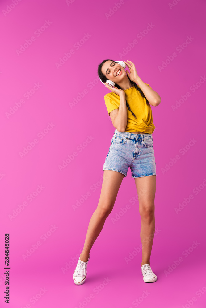 Full length of a cheerful young brunette girl Full length of a cheerful young brunette girl