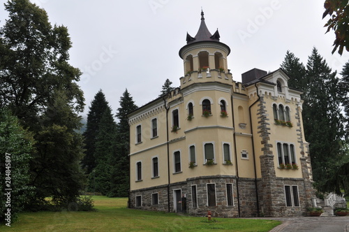 Yellow castle in Italy and mountains