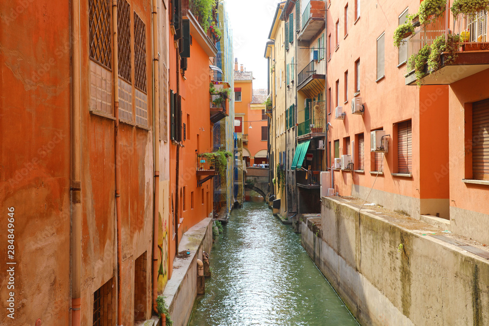 Italian houses between the hidden canal of Reno river, Bologna, Italy.