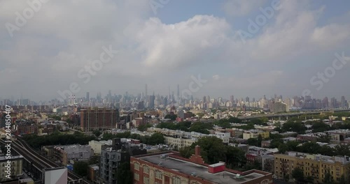 Drone moving over Bronx with Manhattan skyline background photo