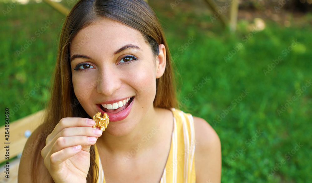 Young woman eating healthy diet food in park. Copy space. Young woman eating healthy diet food in park. Copy space.