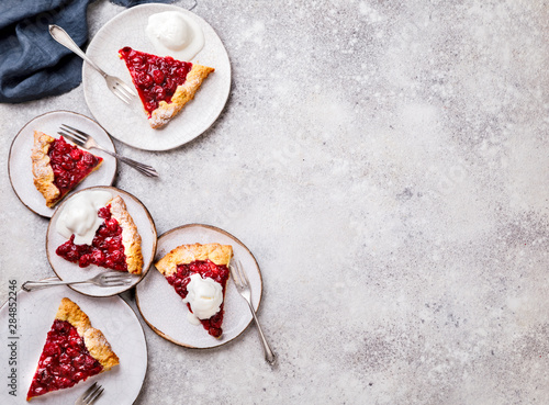 Bakery products. Summer pie with berries. Galeta with cherry sprinkled with powdered sugar. Copy space. photo