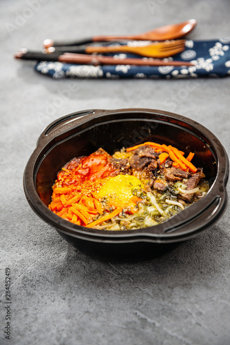 Bibimbap Rice, vegetables, minced marinated beef, spicy sauce and egg yolk