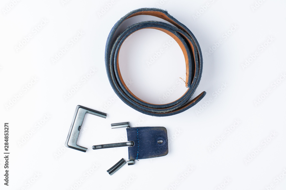 Broken blue pants belt isolated on white background.Copy space Broken blue pants belt isolated on white background.Copy space