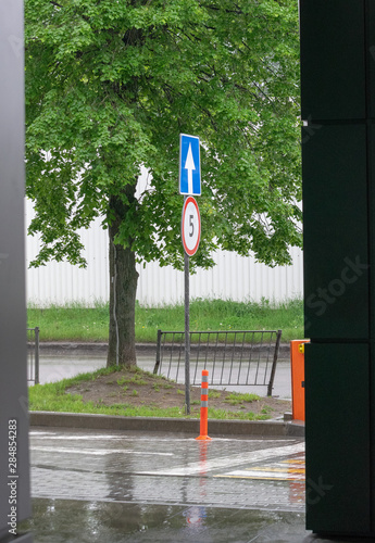 Road sign on city background