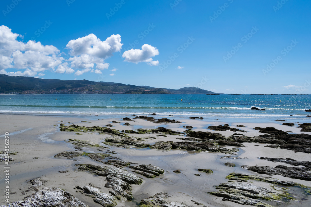 Fototapeta premium Rocks on the seashore on a beach in galicia
