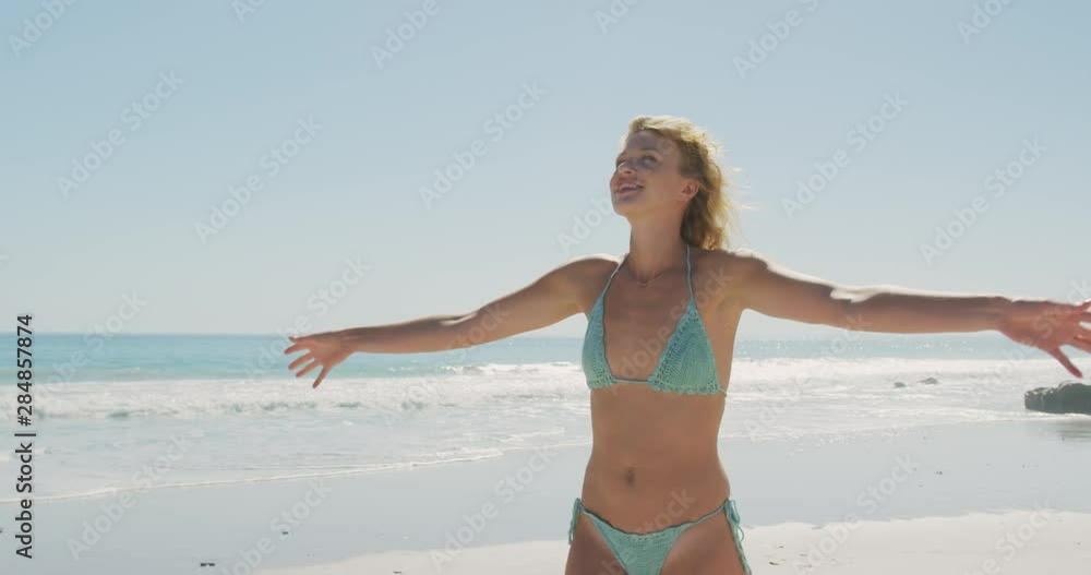 Young woman relaxing by the sea 4k Young woman relaxing by the sea 4k