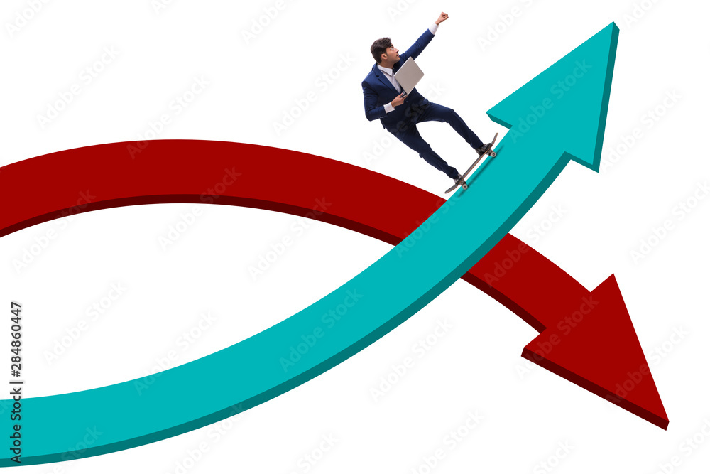 Businessman riding skateboard on financial graph Businessman riding skateboard on financial graph