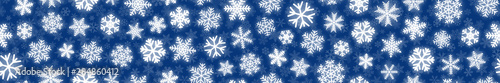 Christmas horizontal seamless banner of white snowflakes on blue background