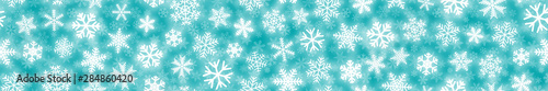Christmas horizontal seamless banner of white snowflakes on turquoise background