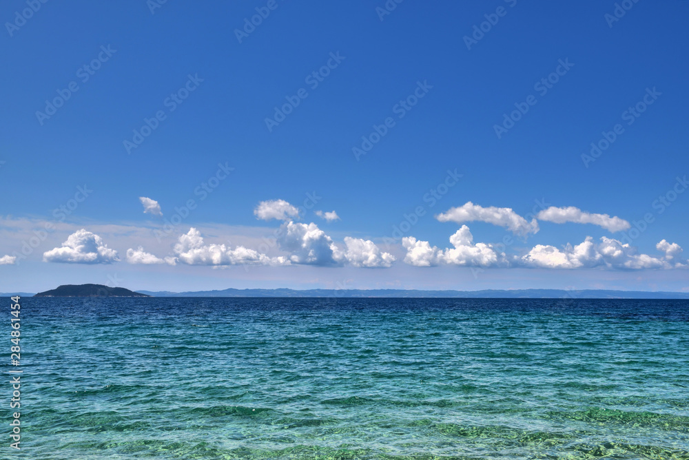 Sea view from beach. Landscape with the sea and the beautiful clouds in the blue sky