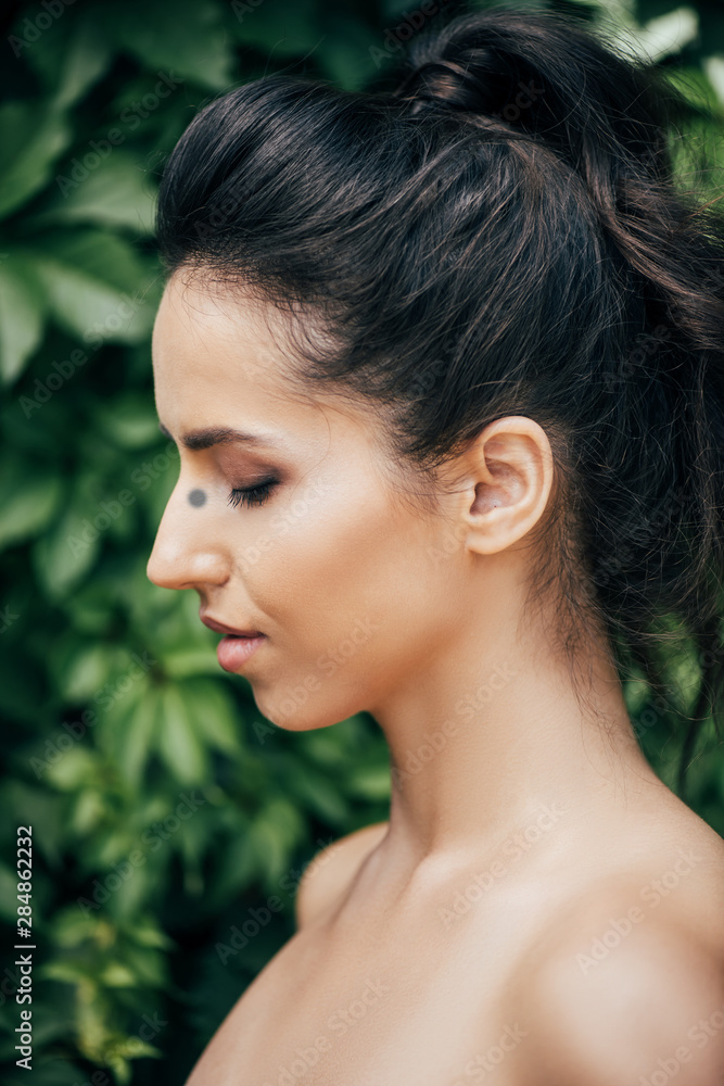 side view of beautiful young and naked woman with closed eyes side view of beautiful young and naked woman with closed eyes