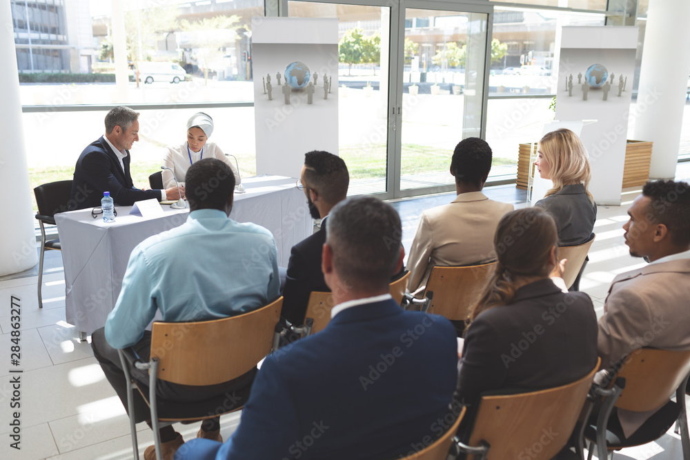 Business people attending a business seminar