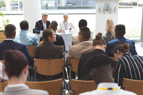 Group of business people attending a business seminar