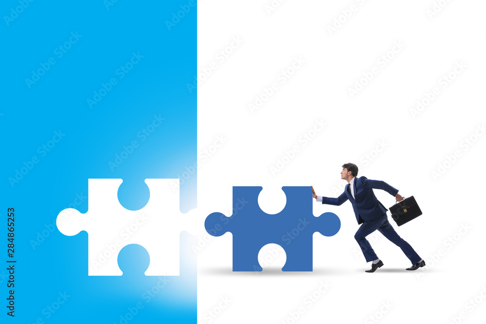 Concept of businessman with missing jigsaw puzzle piece Concept of businessman with missing jigsaw puzzle piece