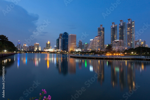 Twilight time at the business district from Benjakiti Park Bangkok , Thailand