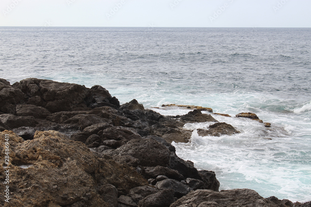 Waves crashing on rocks