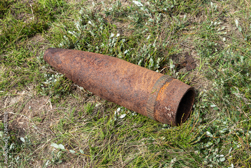 Unexploded bomb in a field. photo