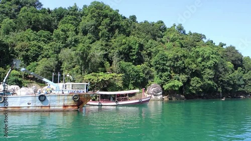 Old Blue Boat and Tourist Boat on Koh Krabey Island photo