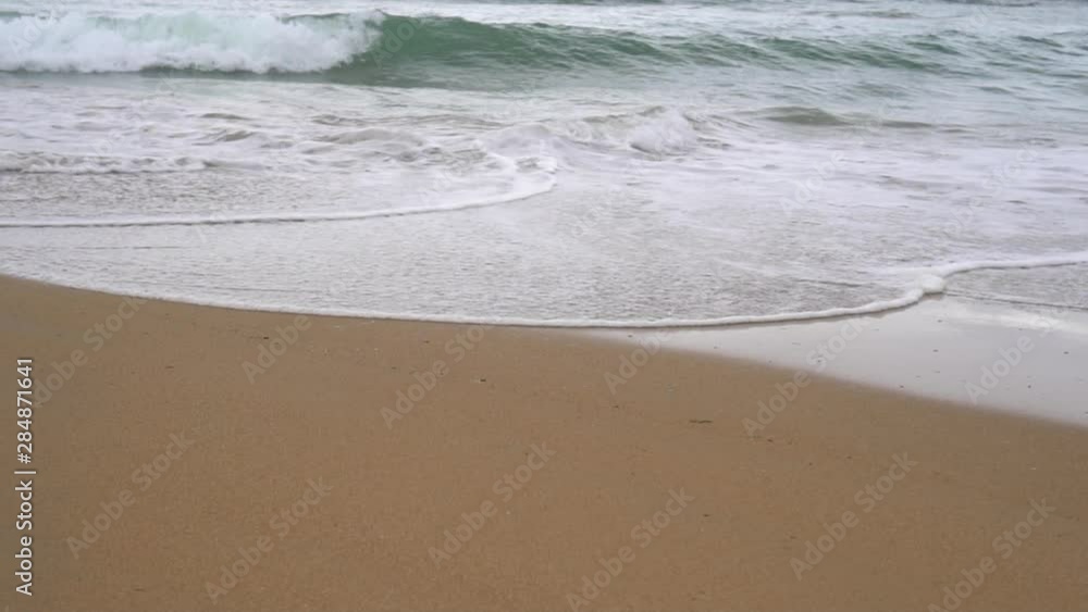 Calm evening ocean surf. Foamy waves fill the sandy beach. The concept of calm and meditation. Calm evening ocean surf. Foamy waves fill the sandy beach. The concept of calm and meditation.