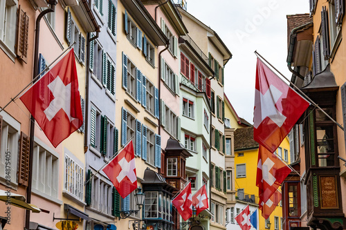 Swiss flags on the traditional buildings in Switzerland
