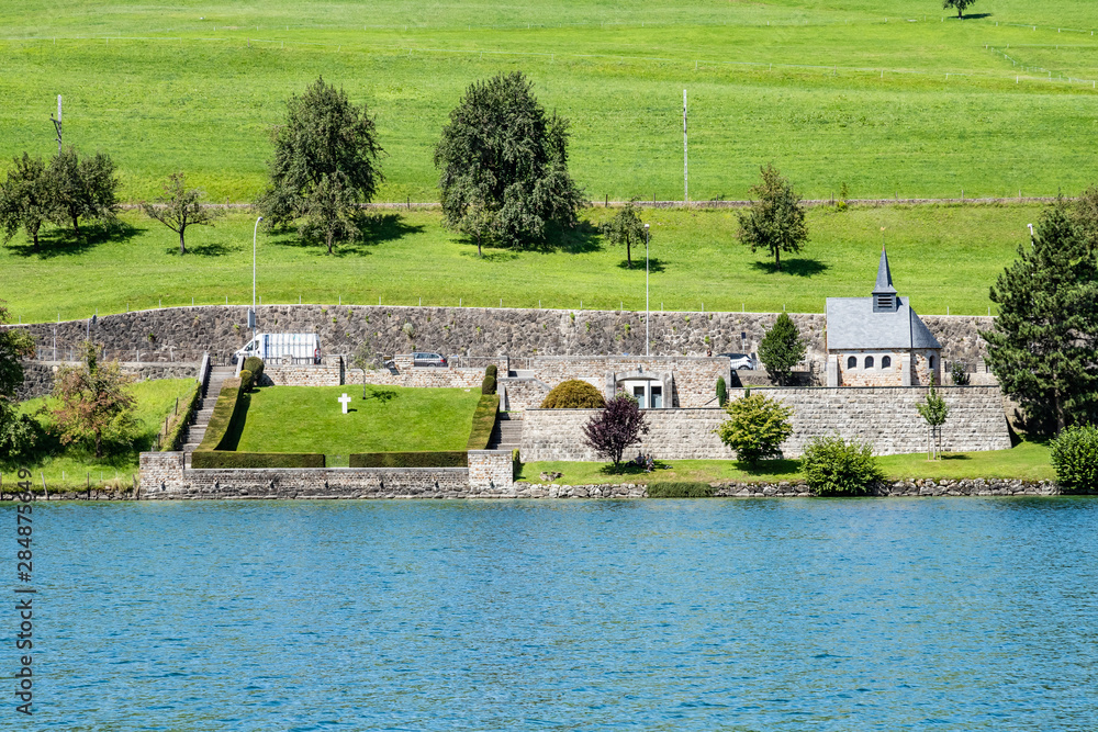 Swiss village on the lake. Beautiful church 