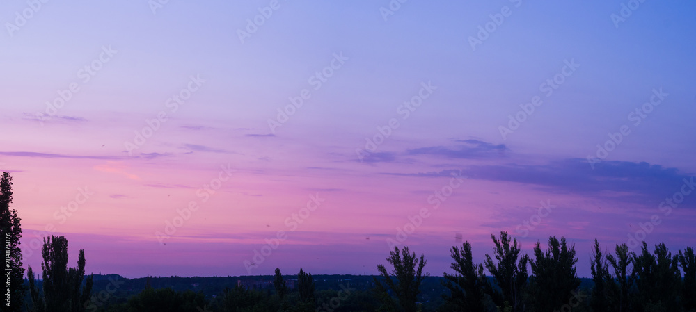 Fototapeta premium Landscape with dramatic light - beautiful golden sunset with saturated sky and clouds.