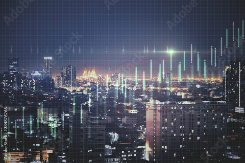 Growth concept with business chart at night megapolis city background.