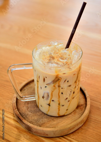 Ice coffee on wooden tray