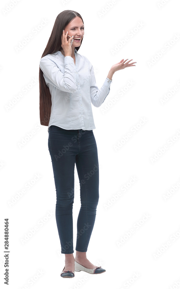 smiling young woman talking on her smartphone. isolated on white smiling young woman talking on her smartphone. isolated on white