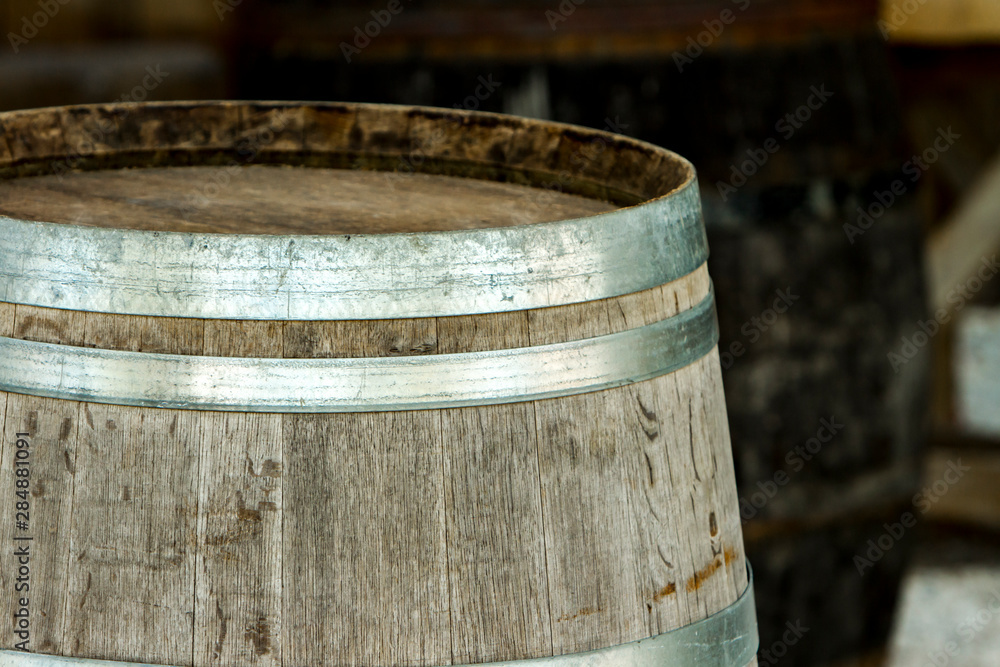 Old wooden barrel with metal strips