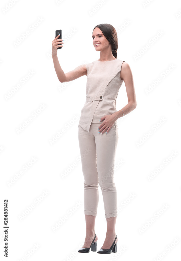 in full growth. smiling young woman talking on video connection in full growth. smiling young woman talking on video connection