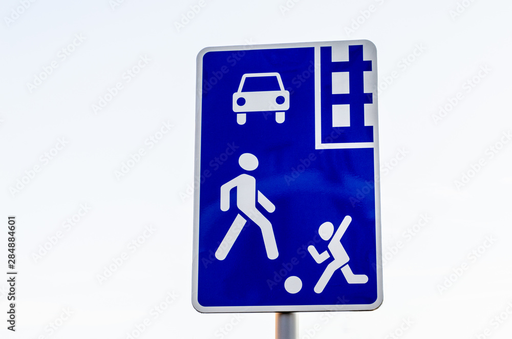 European living space road sign on a white background. A sign with children playing on the road. European living space road sign on a white background. A sign with children playing on the road.