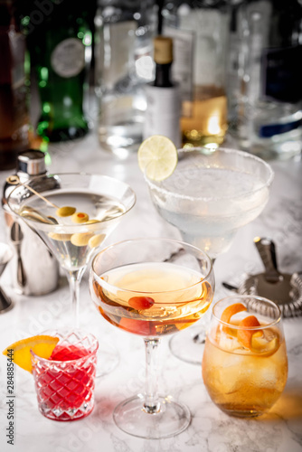 collection of classic cocktails, negroni, old fashioned, manhattan, margarita, martini